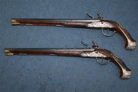 A pair of 18th century Bavarian flintlock holster pistols by Johann Jacob Kuchenreuter, overall length 21.5in.